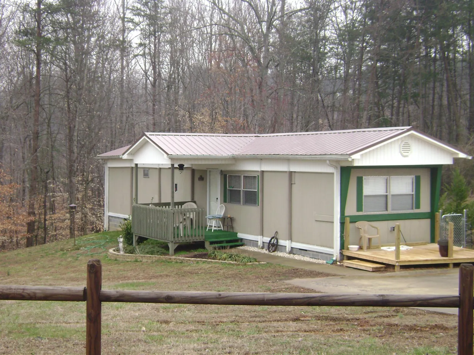 Mauve metal roof on a manufactured home with a new front deck in Beaver Dams